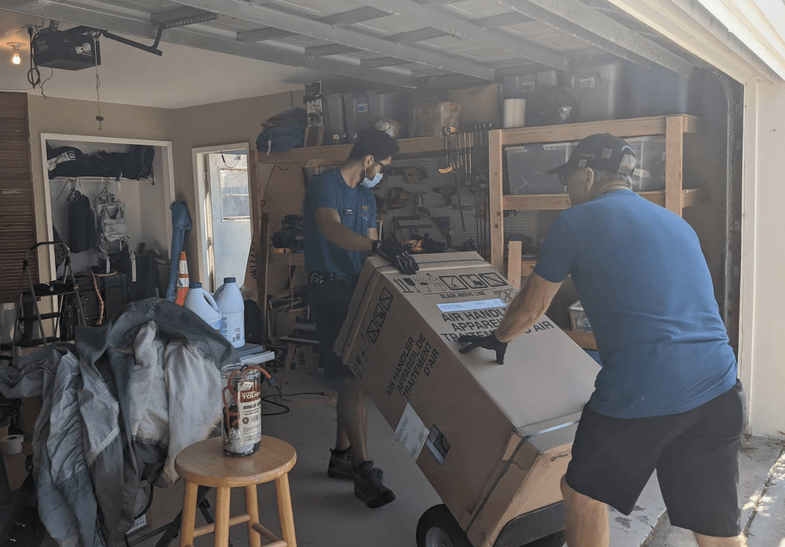 Wayne and Colten loading an air handler